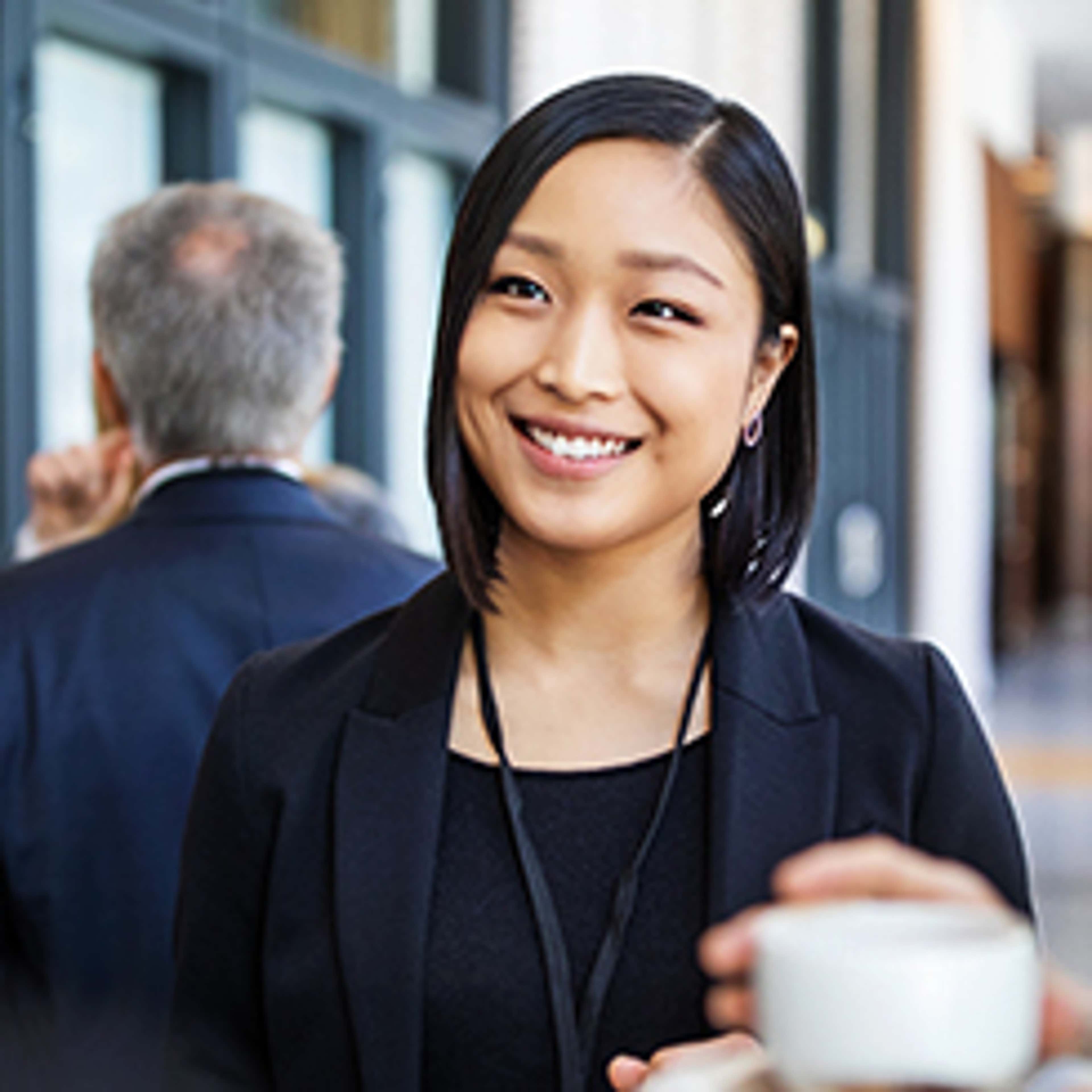 Person smiling with coffee