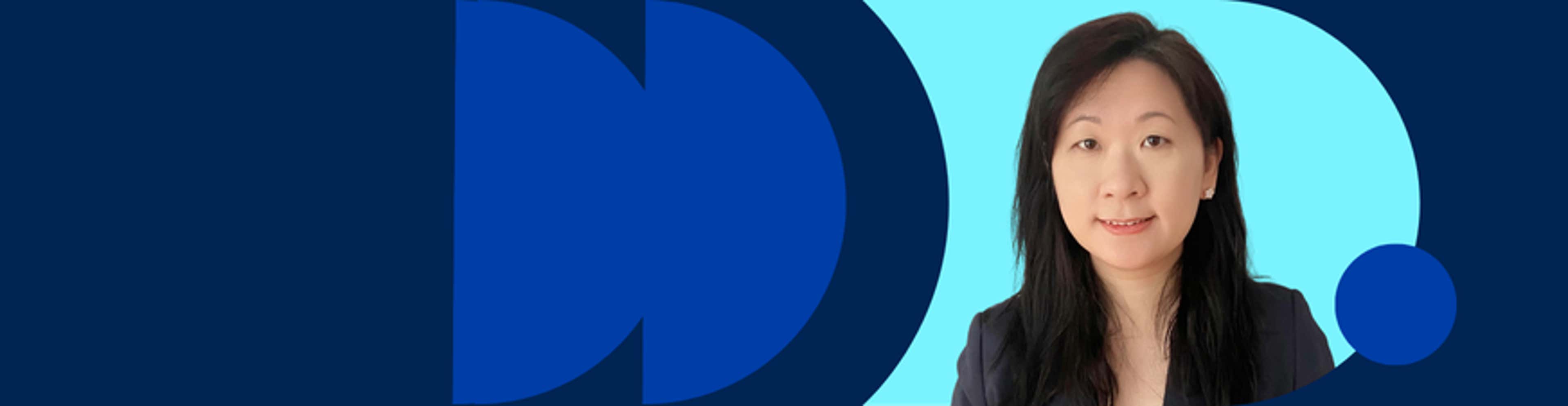 Anna Li in a tailored business suit, exuding professionalism and confidence in her stance.