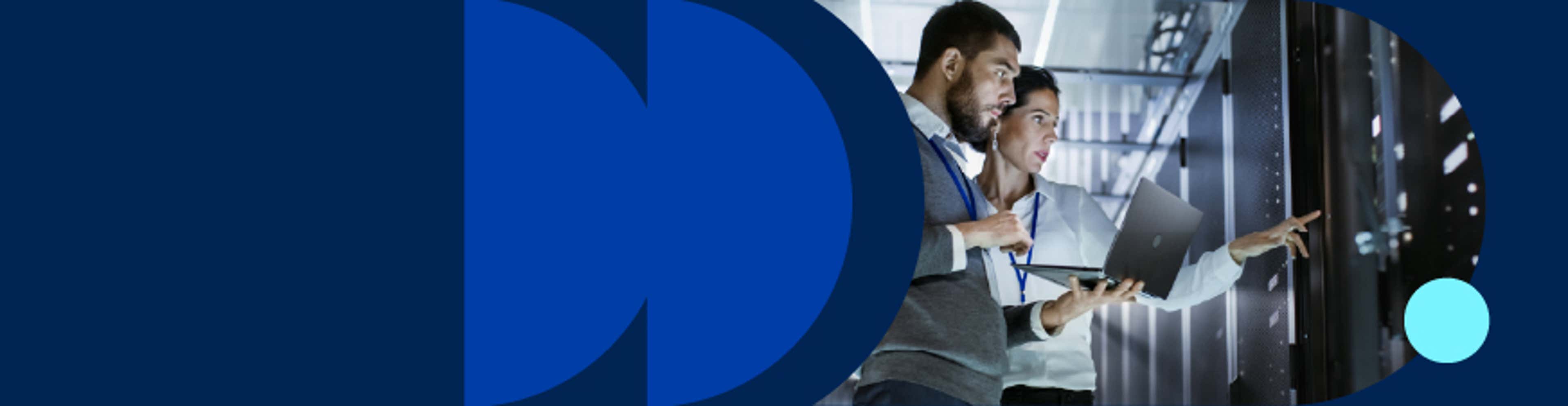 Two people inside a data center