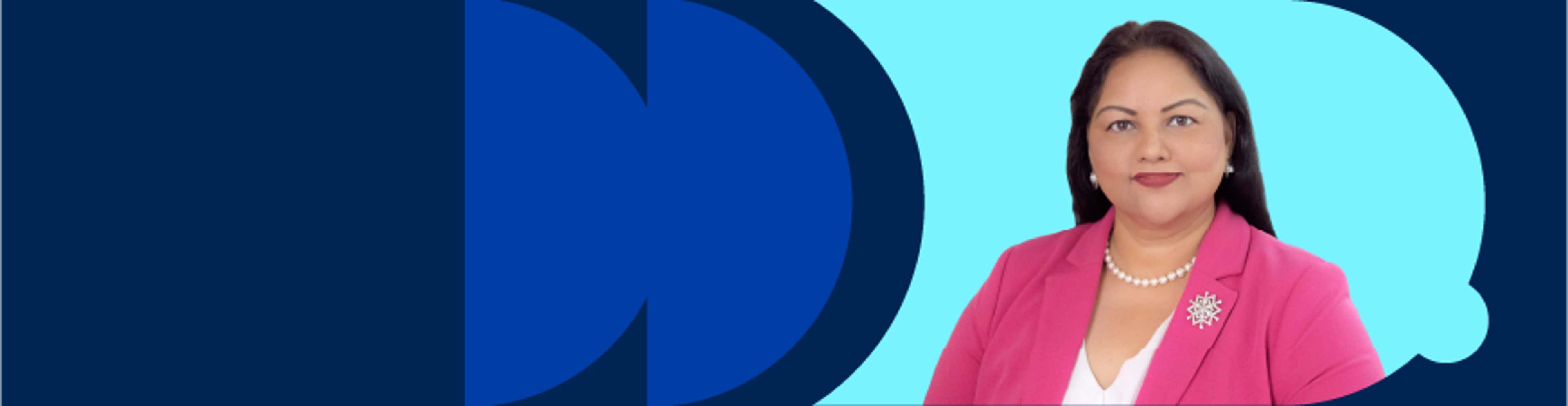 Dr Jodie Lobana wearing a pink blazer and a pearl necklace