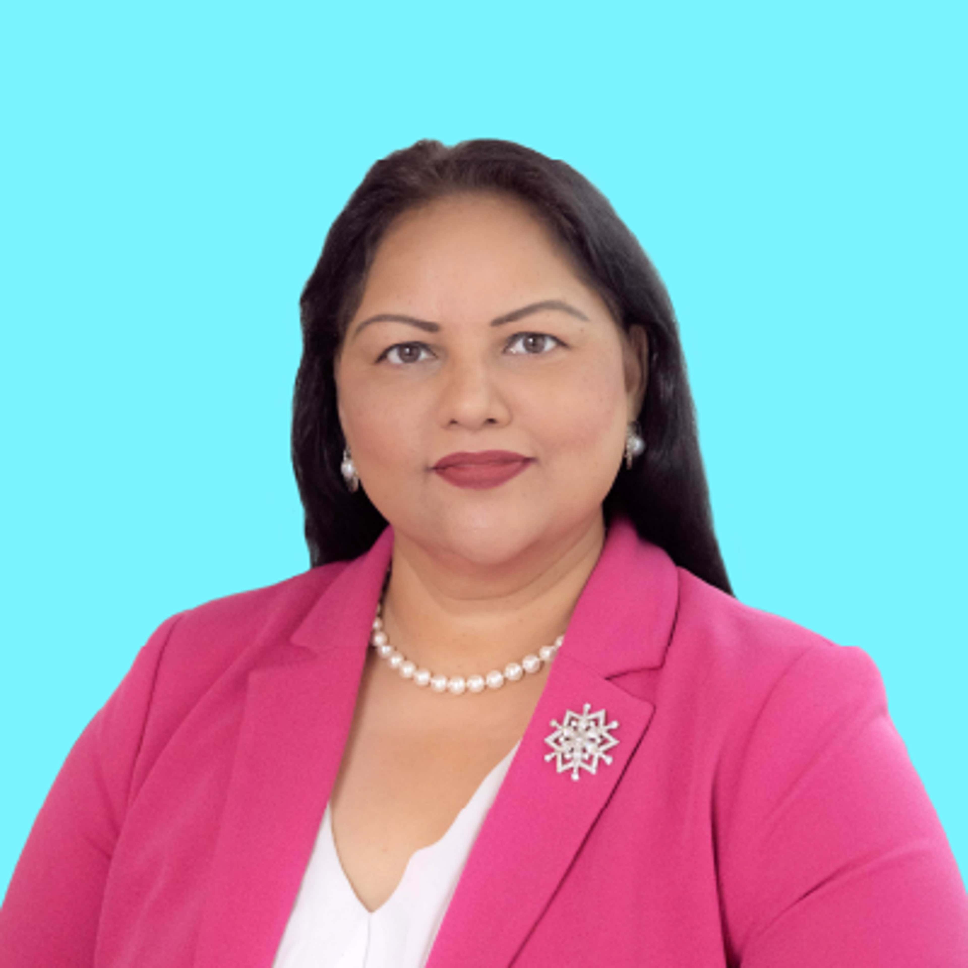 Dr Jodie Lobana wearing a pink blazer and a pearl necklace