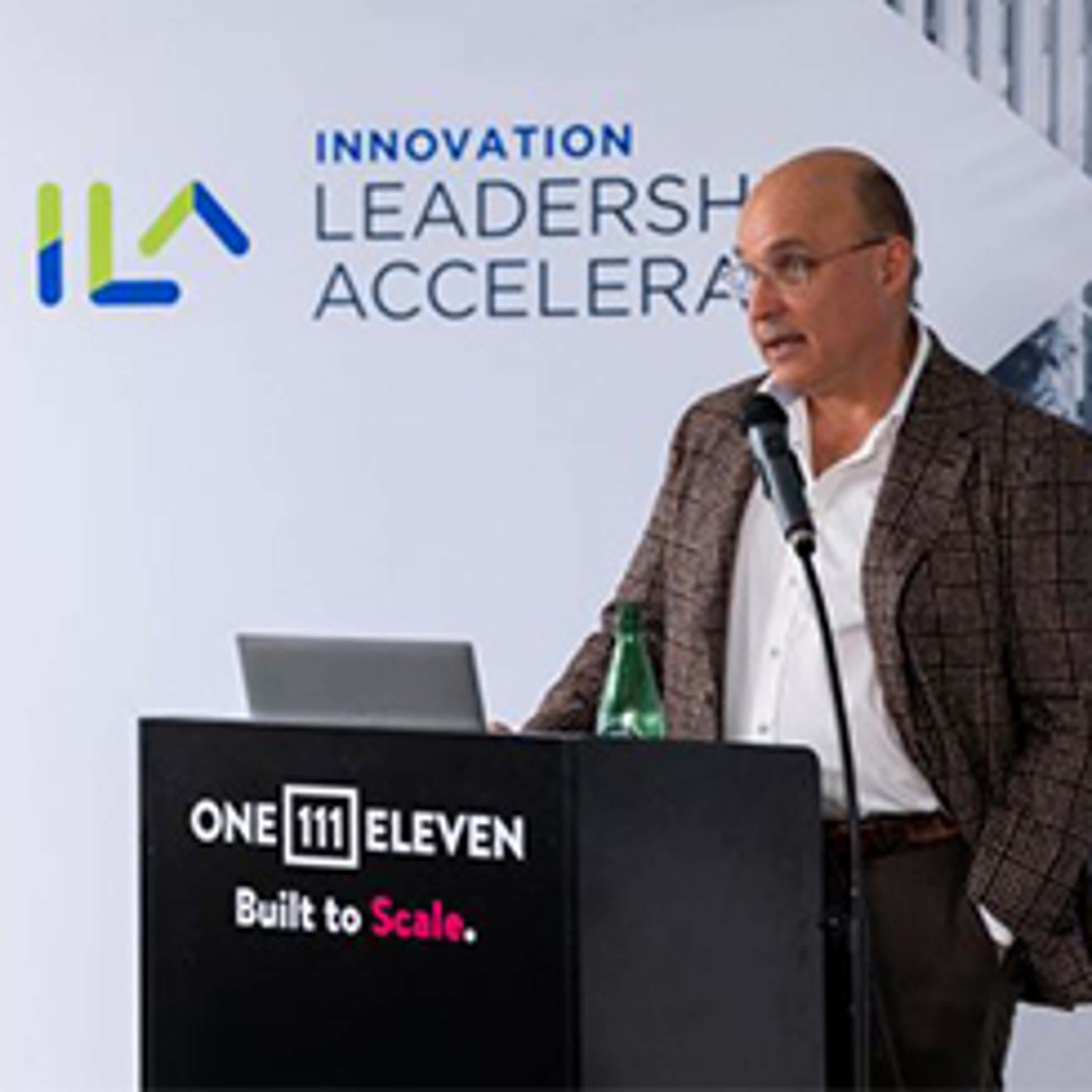 Jim Balsillie speaking behind the podium