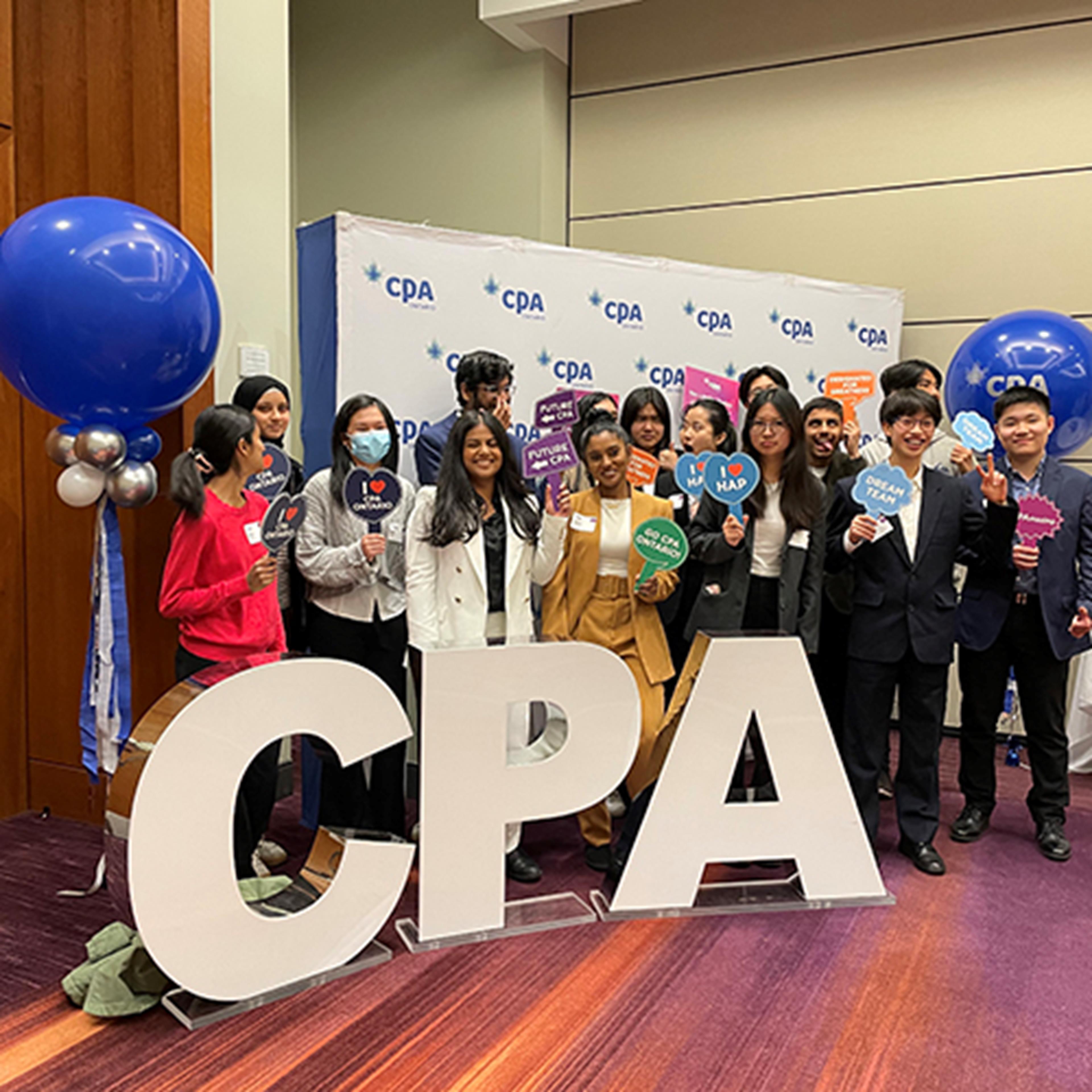 Group of students behind a CPA sign