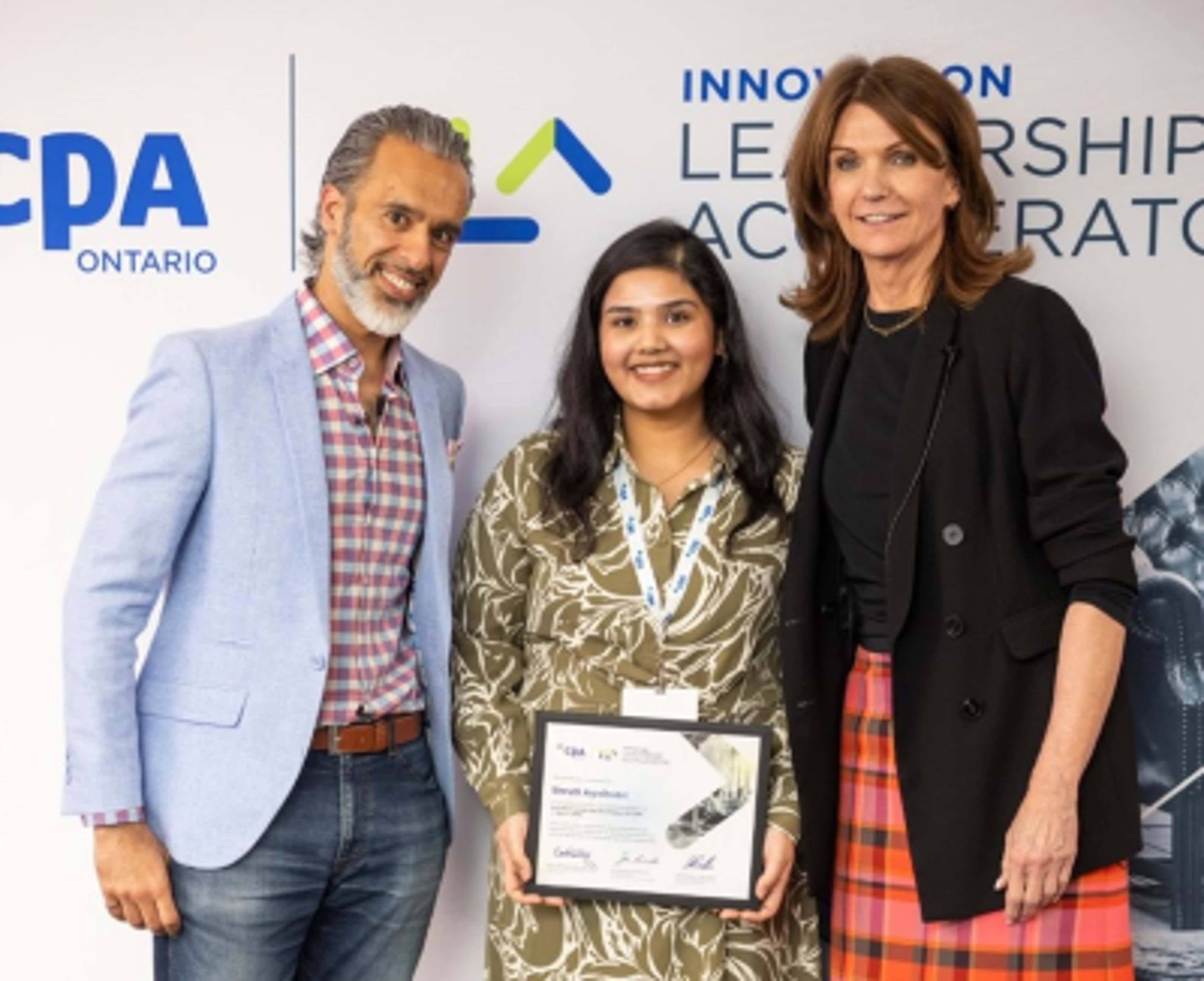 ILA Executive Program Director Paul Nagpal and CPA Ontario President Carol Wilding congratulate Shruti Agnihotrion completing the ILA program 