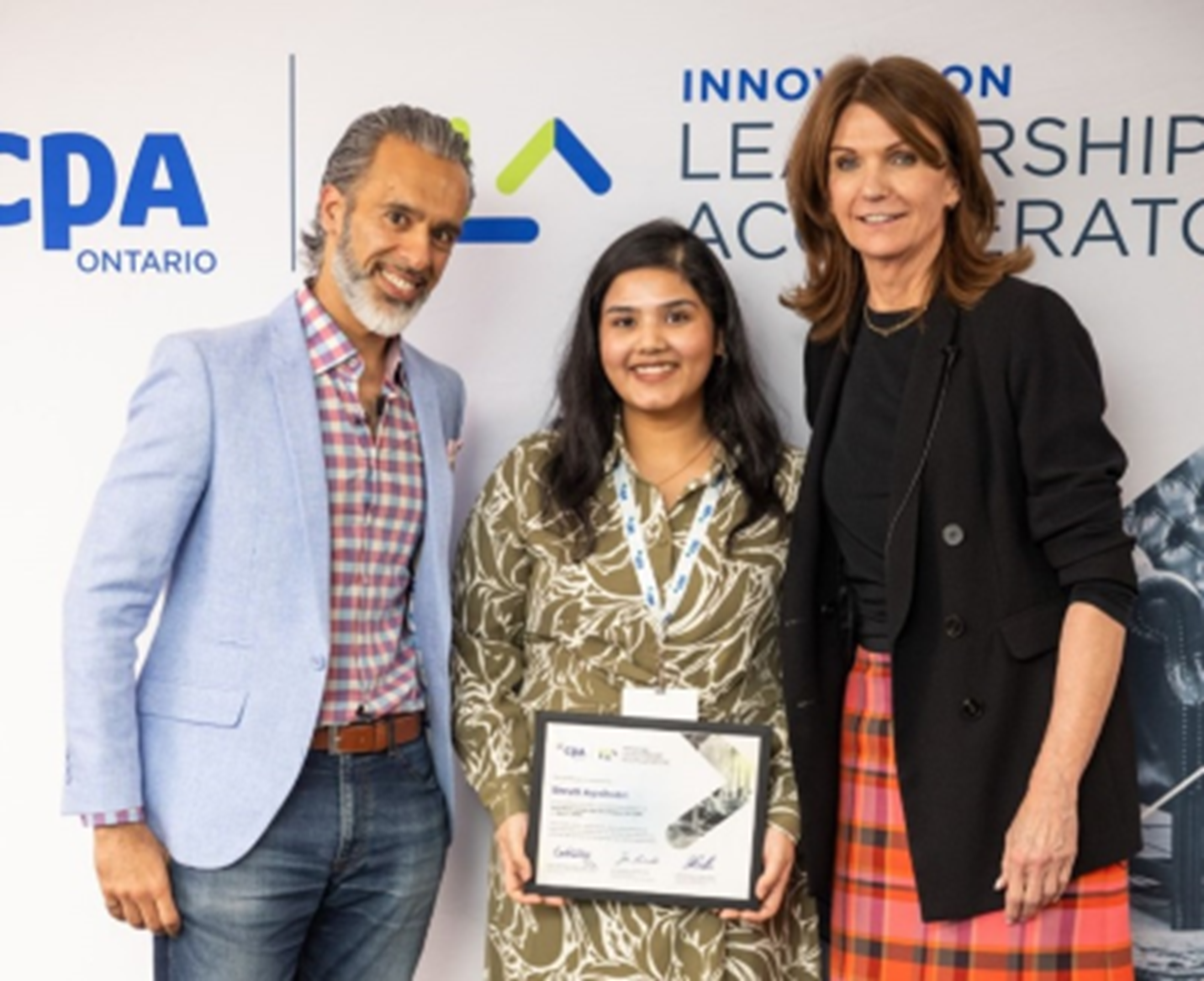 ILA Executive Program Director Paul Nagpal and CPA Ontario President Carol Wilding congratulate Shruti Agnihotrion completing the ILA program 