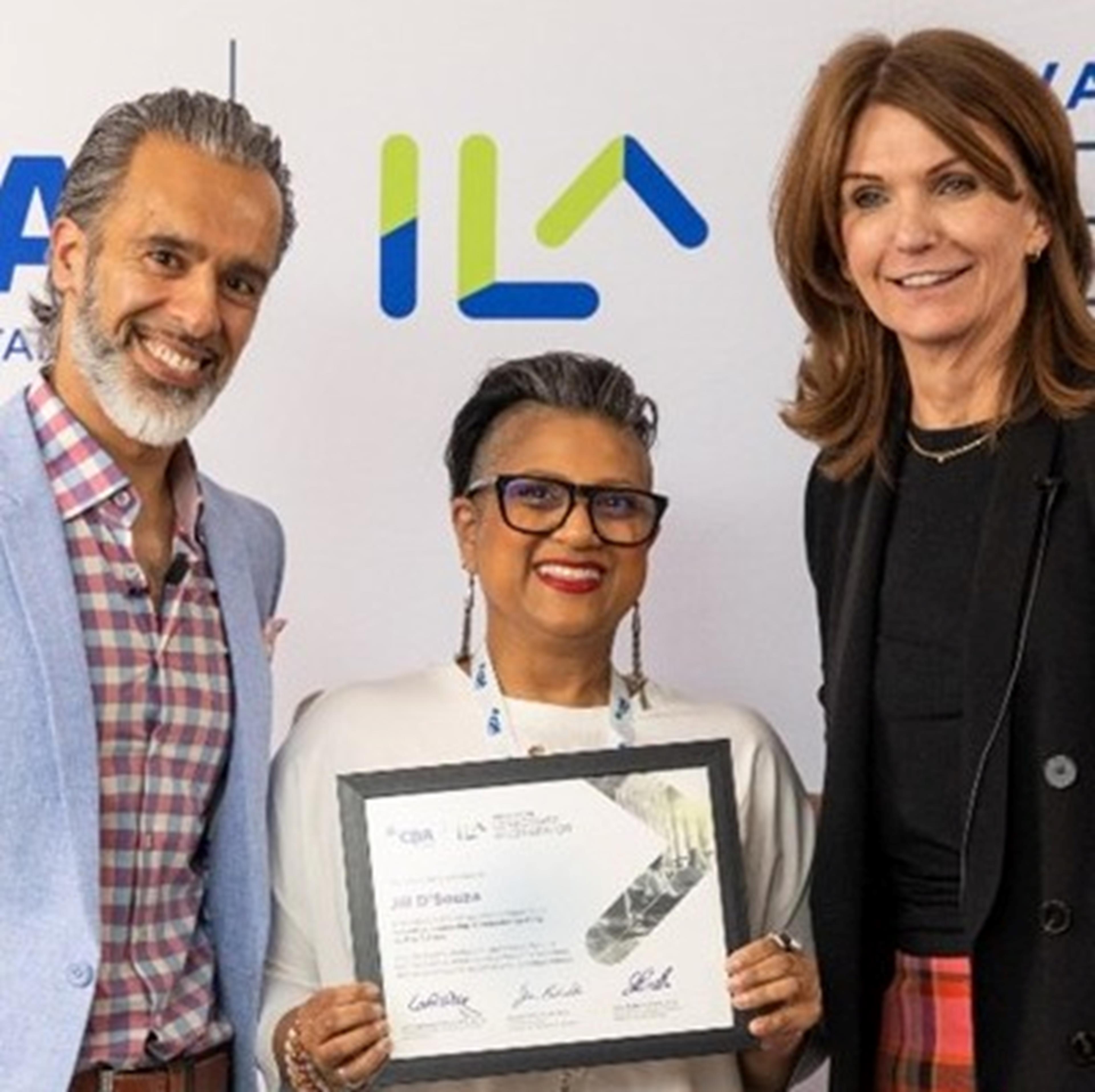 ILA Executive Program Director Paul Nagpal and CPA Ontario President & CEO Carol Wilding congratulating Jill D'Souza on completing the Innovation Leadership Accelerator.