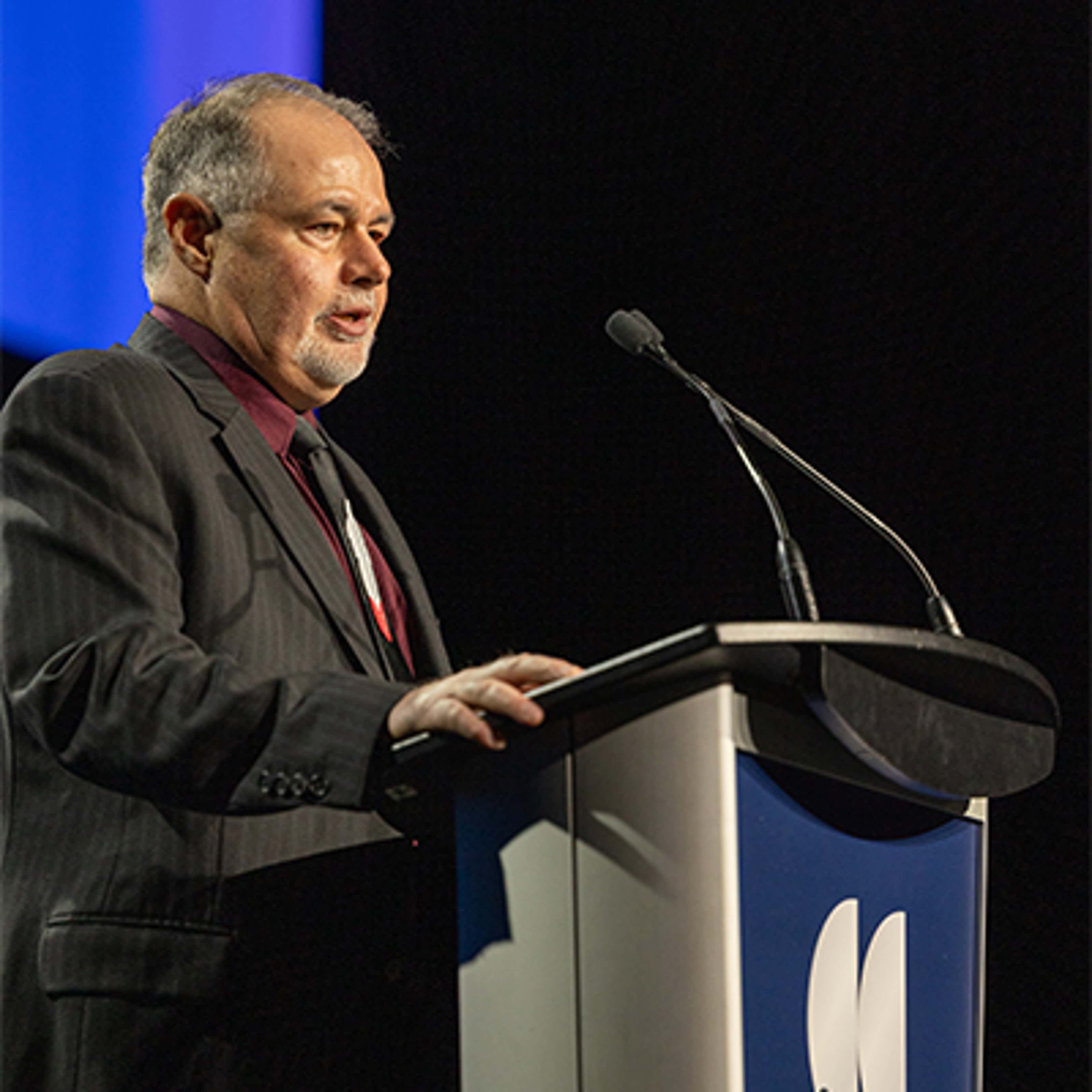 Rick Morano speaking at the podium