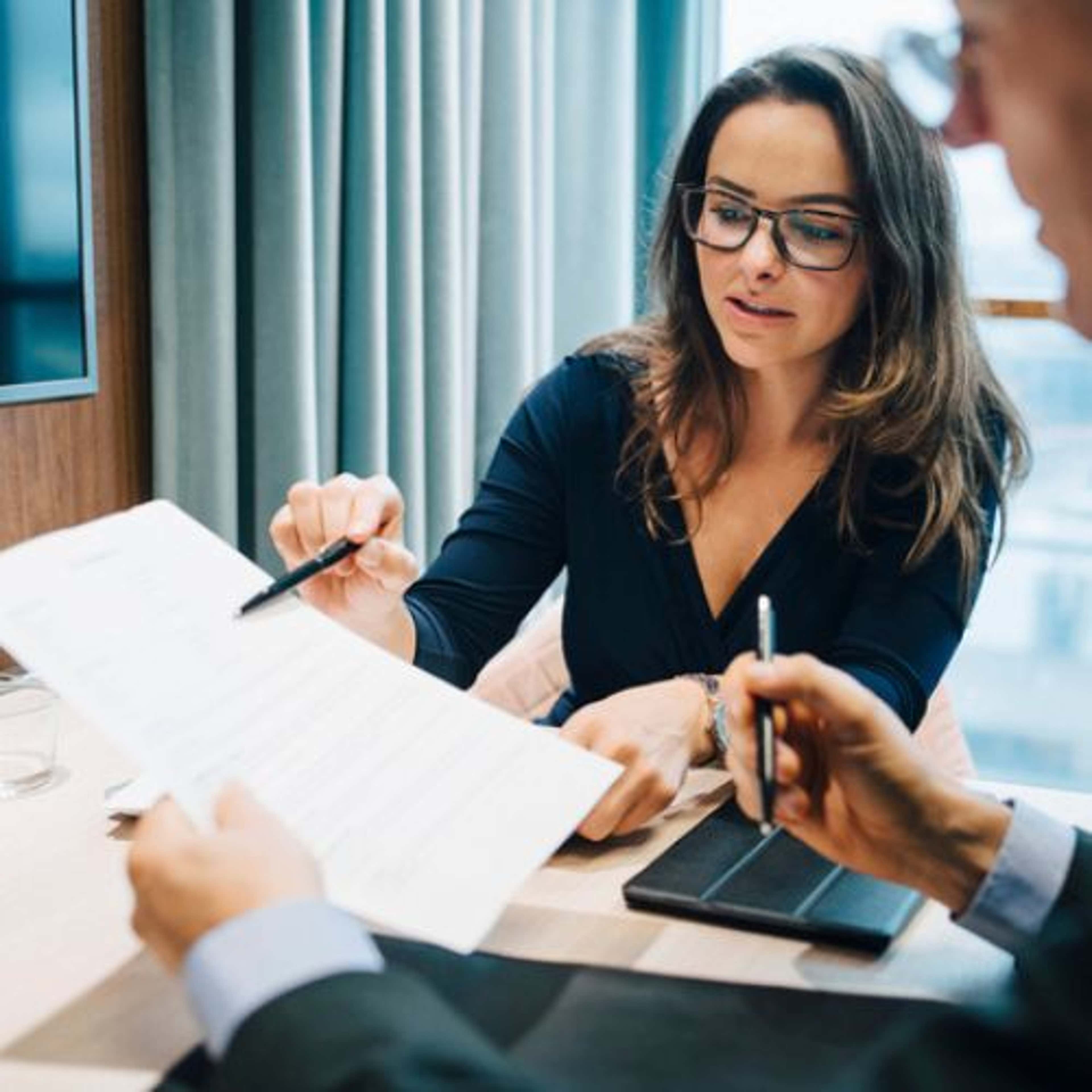 Woman speaking about a document