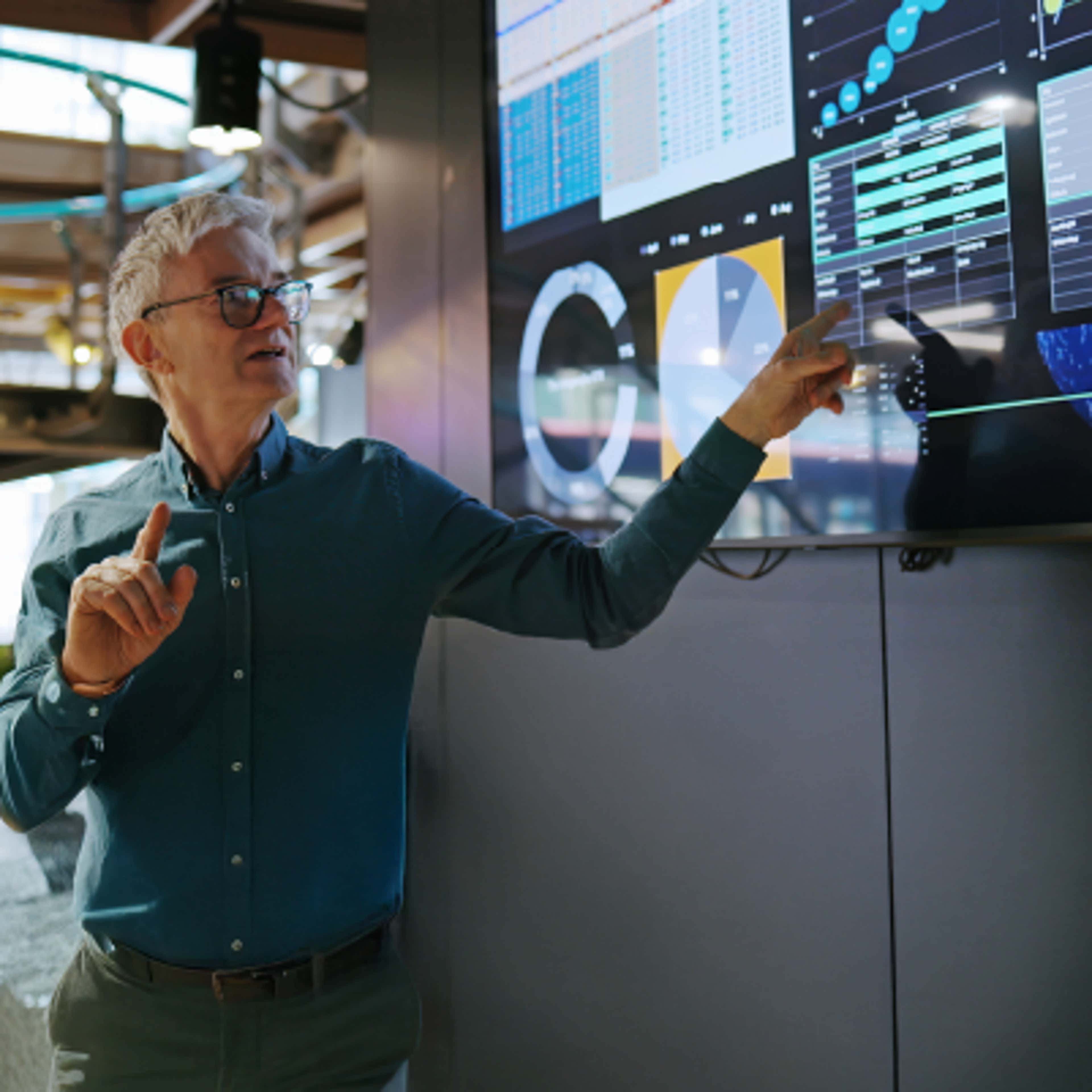 Man pointing at a screen