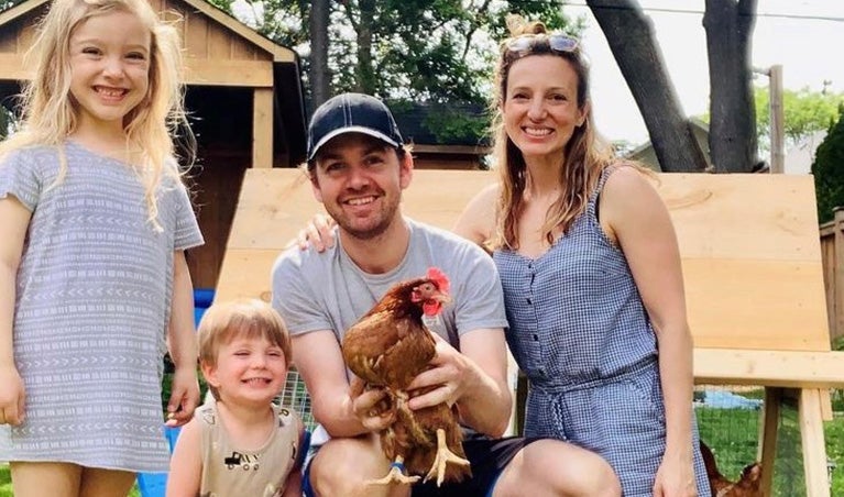 Ewa and Danny with their two kids and chickens