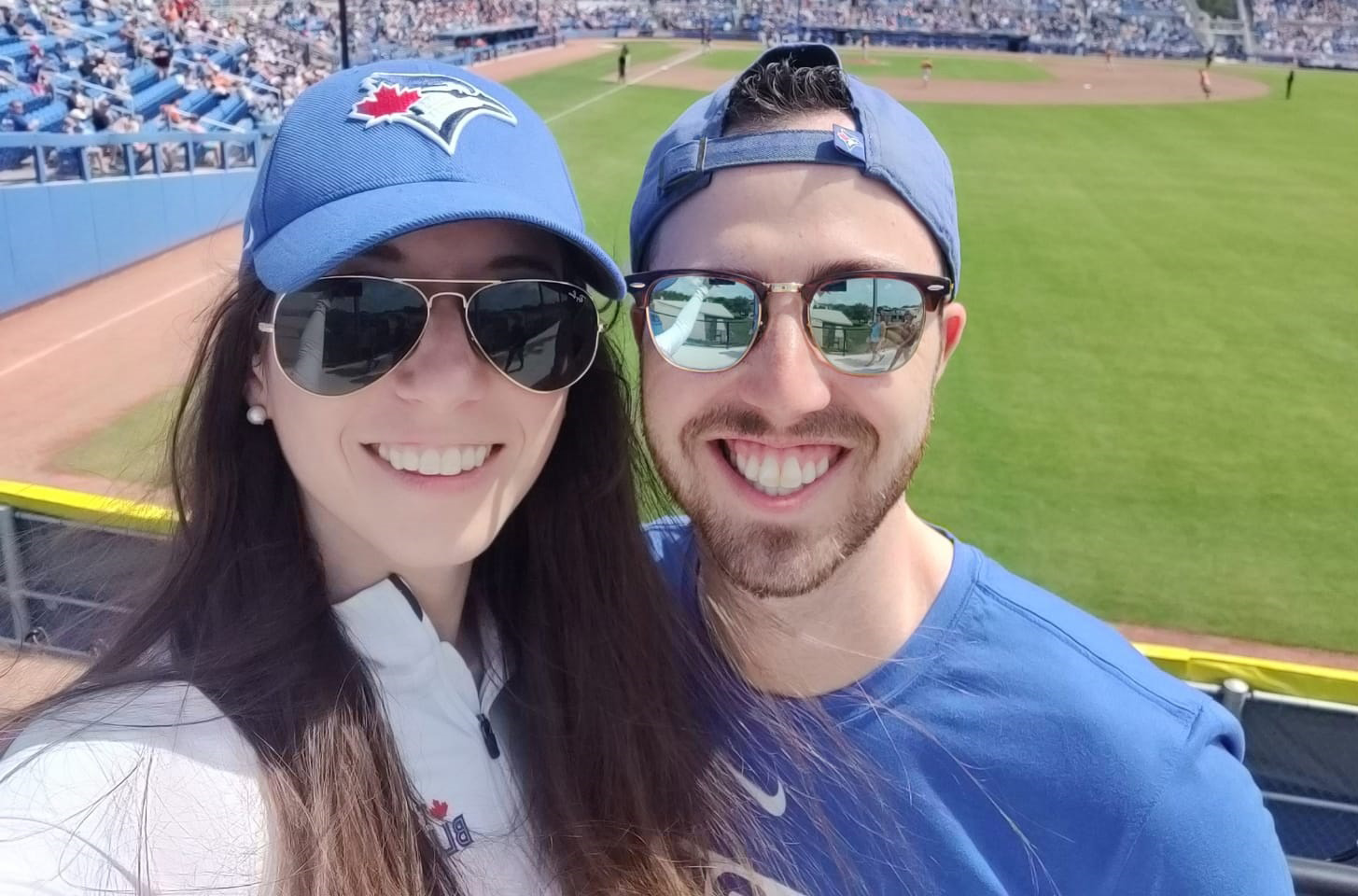 Josh Hoffman with his wife Julie standing together at the Blue Jays' new Spring Training facility in Dunedin, Florida 
