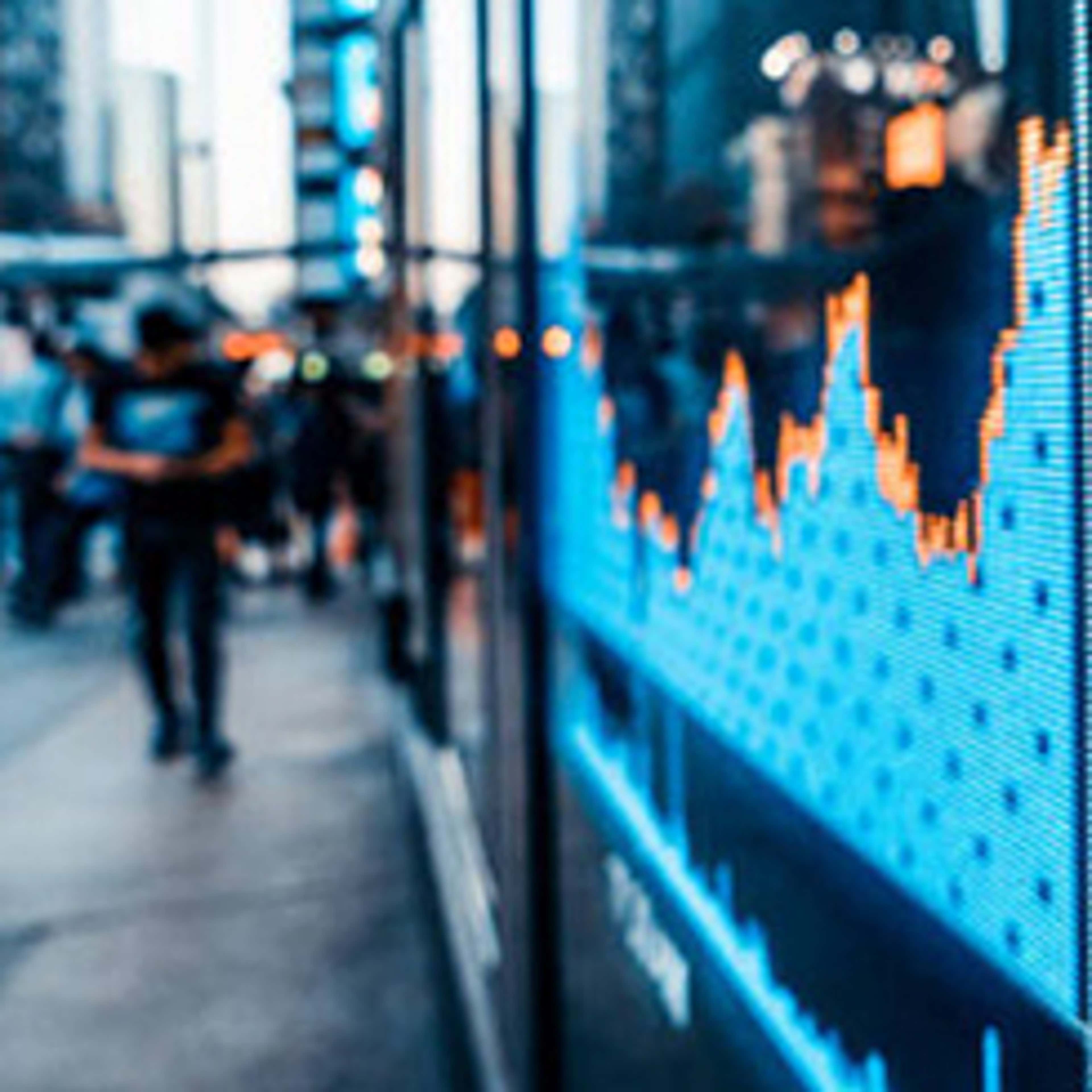 Street view with stock market screen on the side