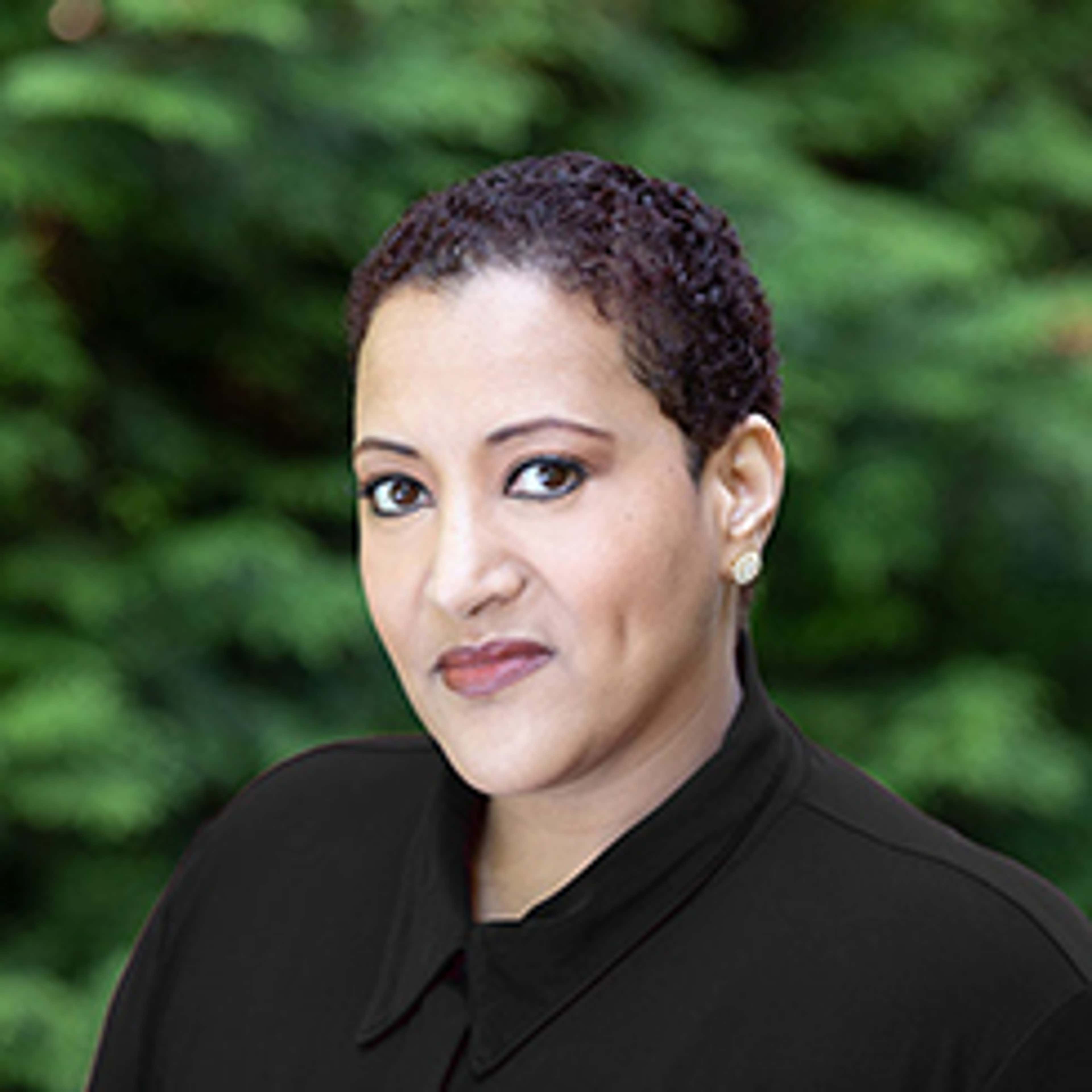 Headshot of Tsedal Neeley against tree