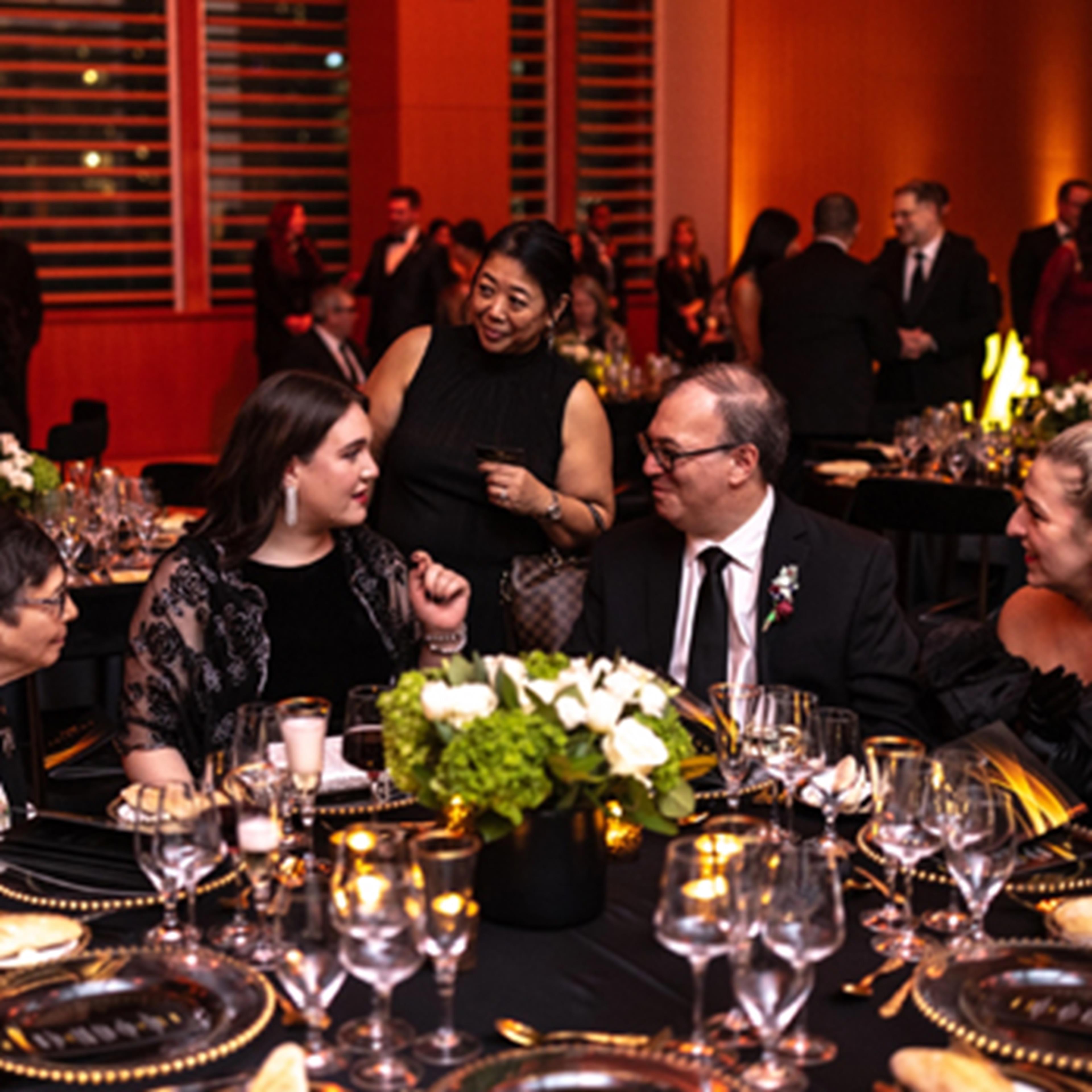 Past Fellows conversing with each other at the Gala