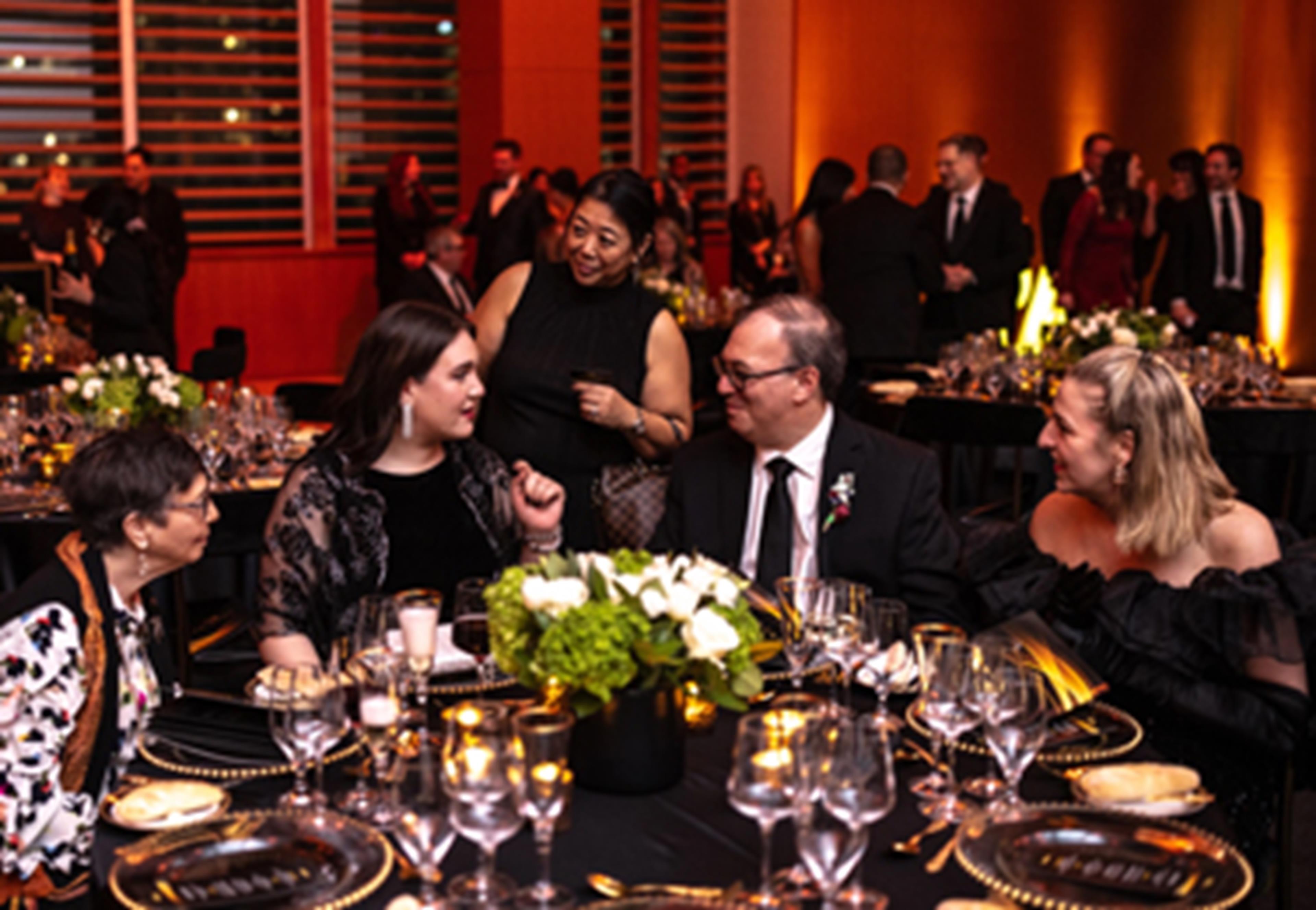 Past Fellows conversing with each other at the Gala