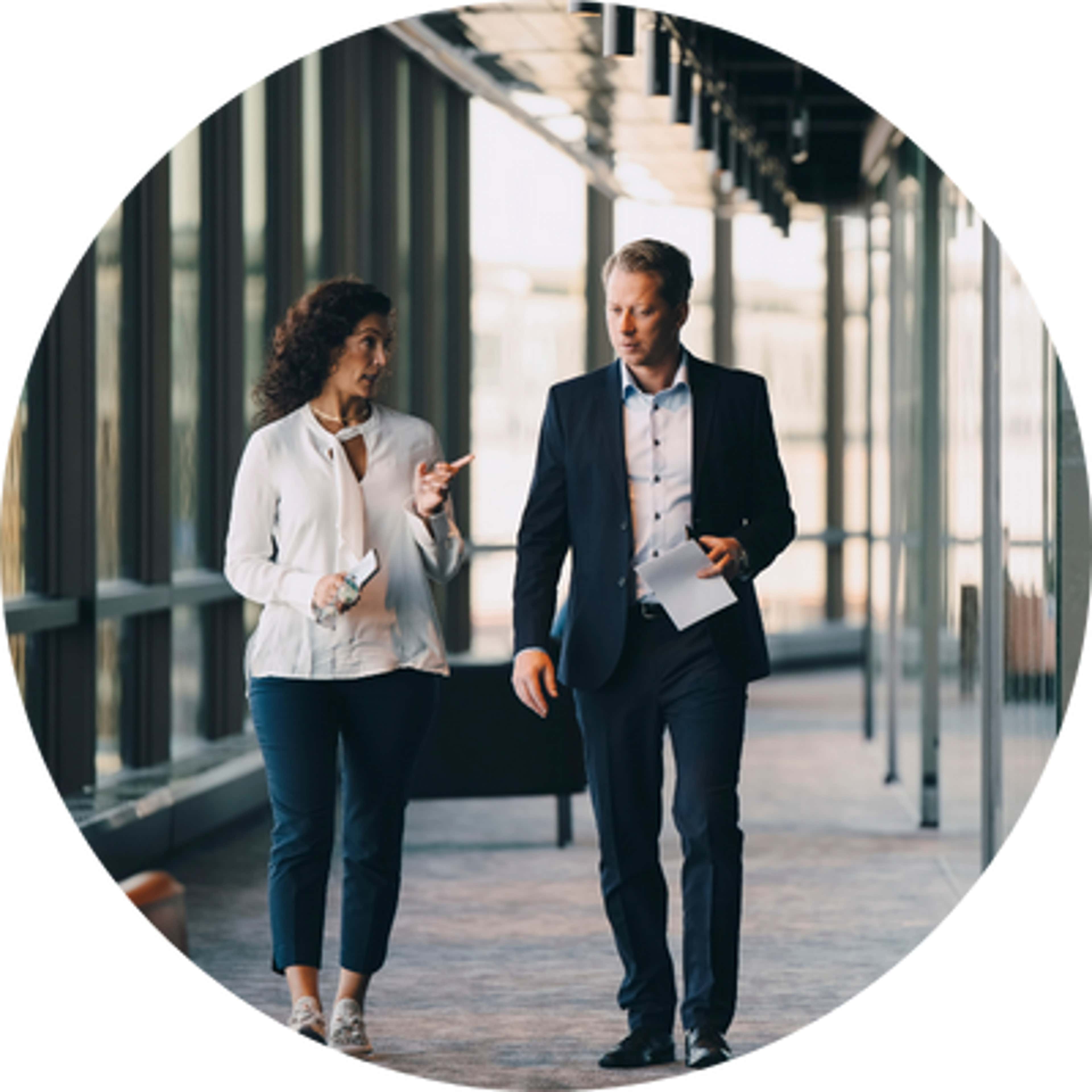 a man and a woman walking and talking