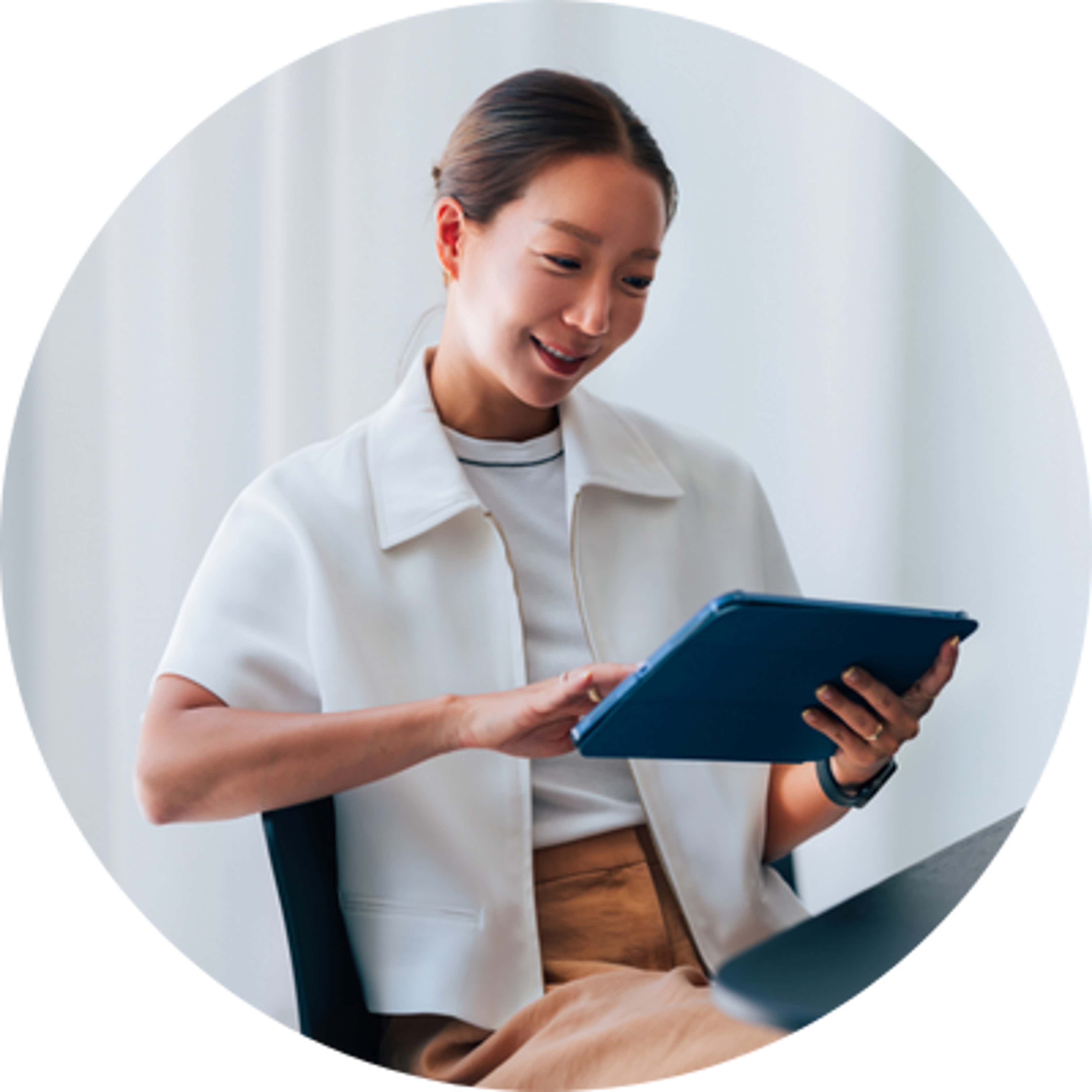 a happy women using an iPad