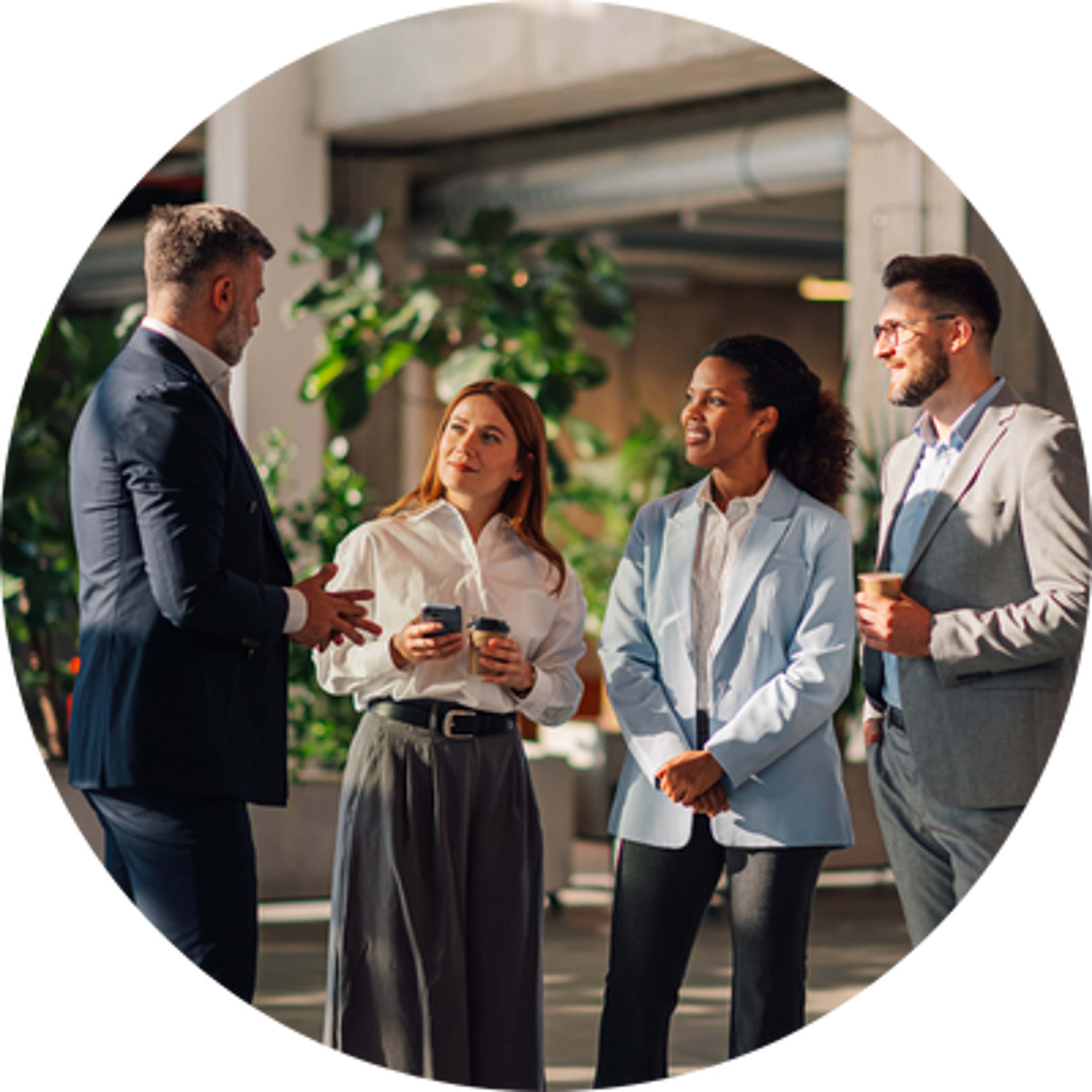 a group of four people in which one man is telling something and one woman and two men are listening to him