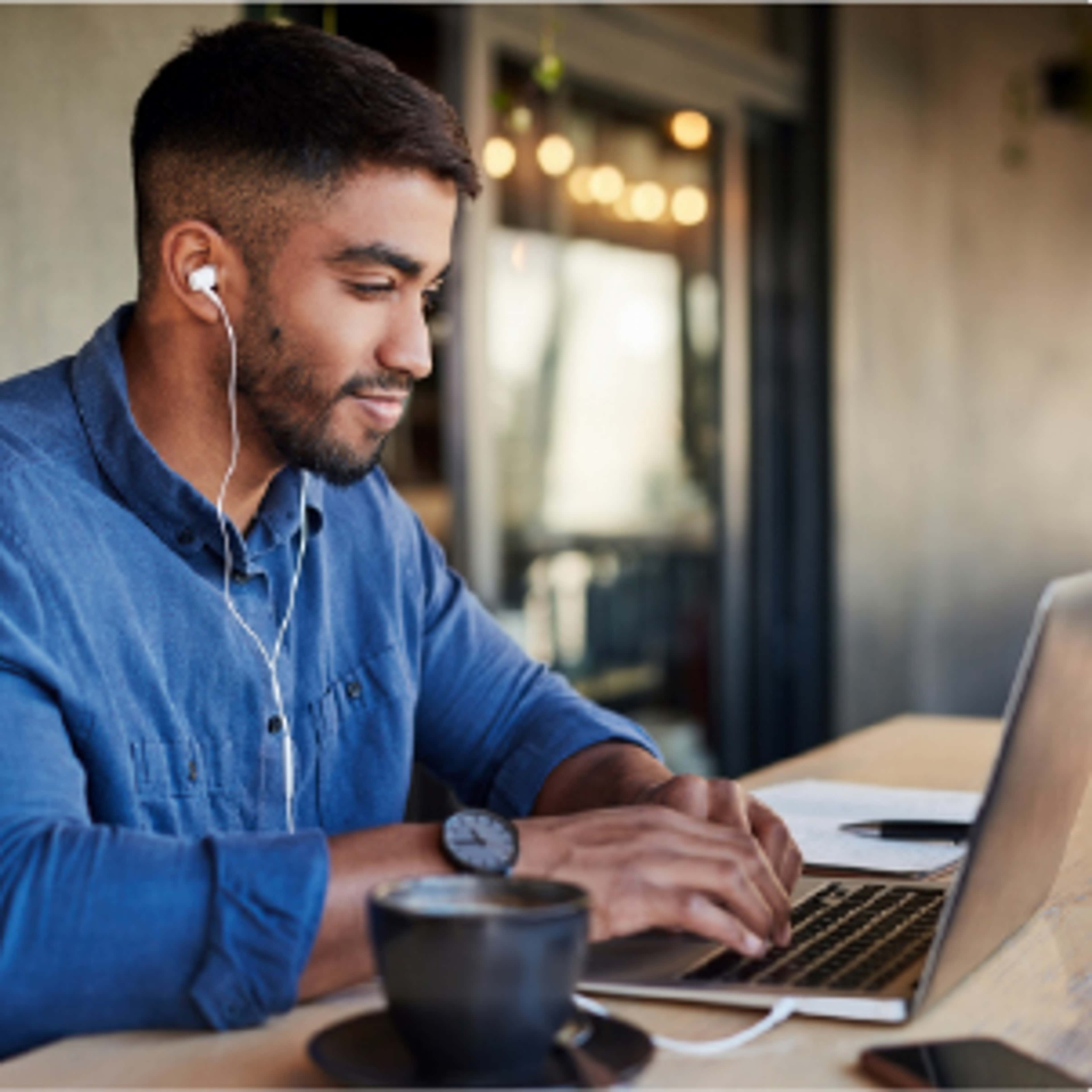 Man typing on laptop