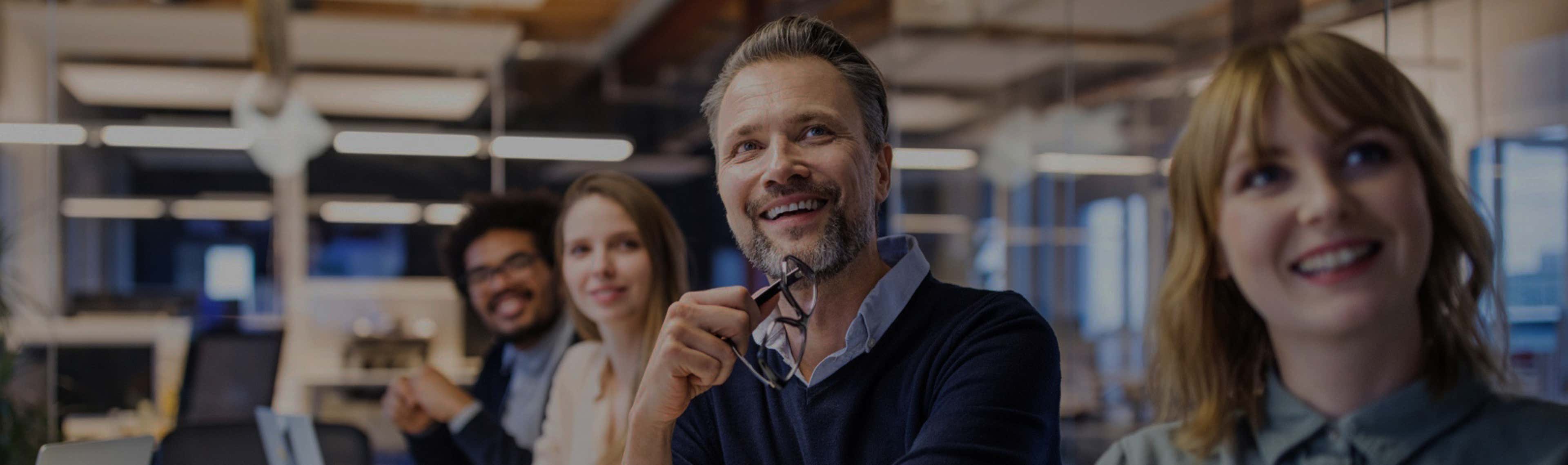 Man with glasses in boardroom