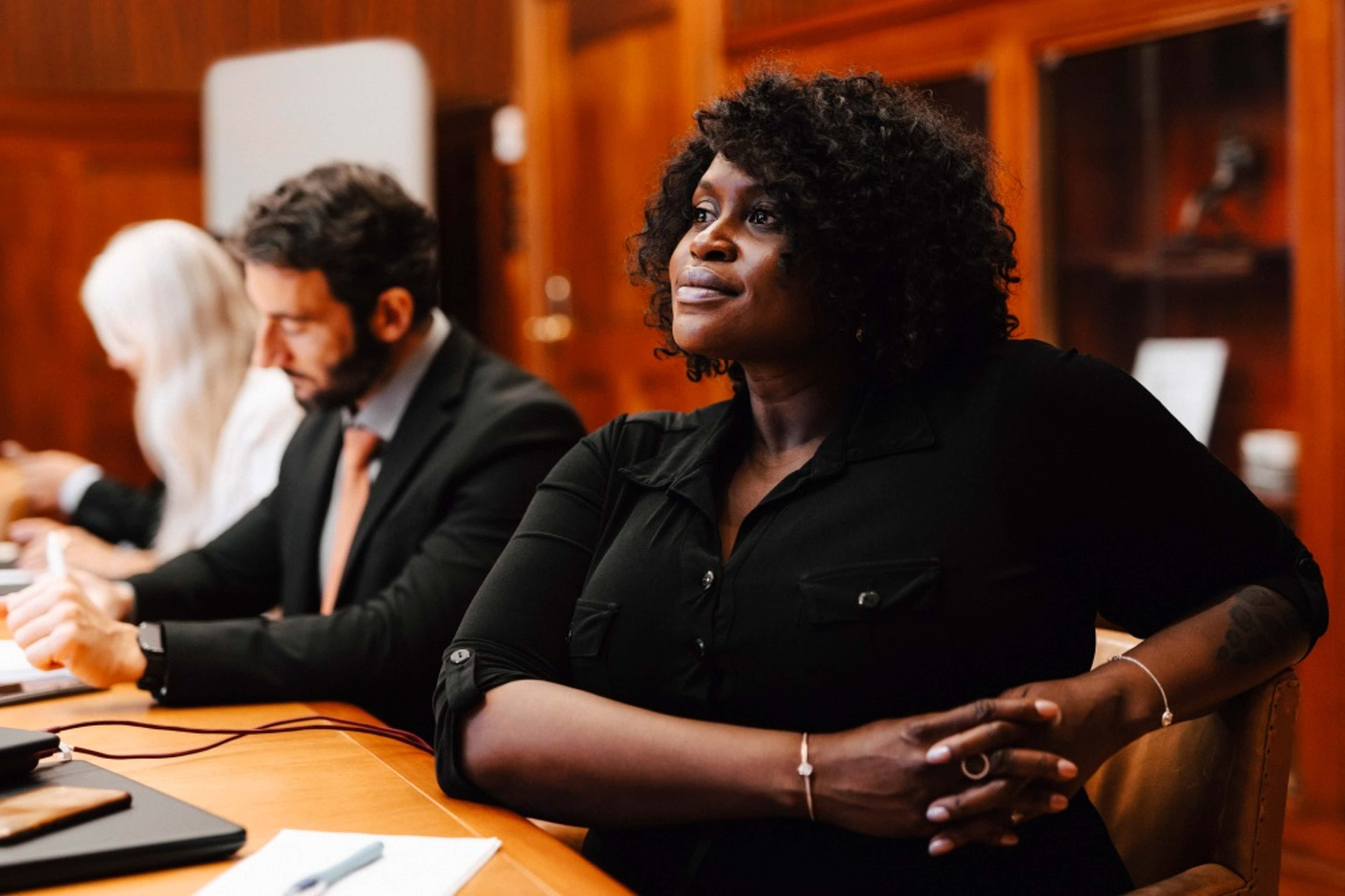 woman sitting in a conference room 