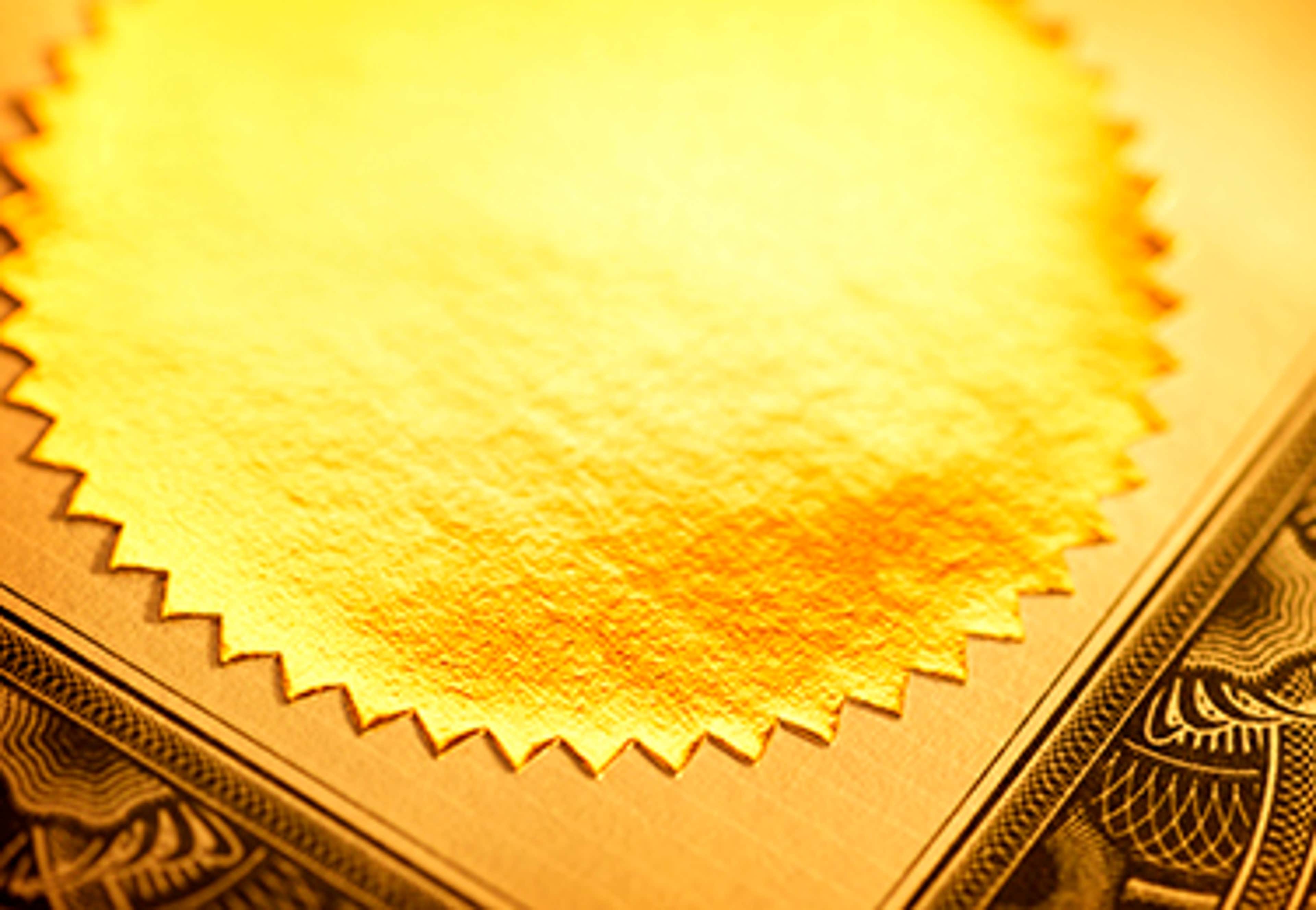 Edge of certificate with golden round seal on it